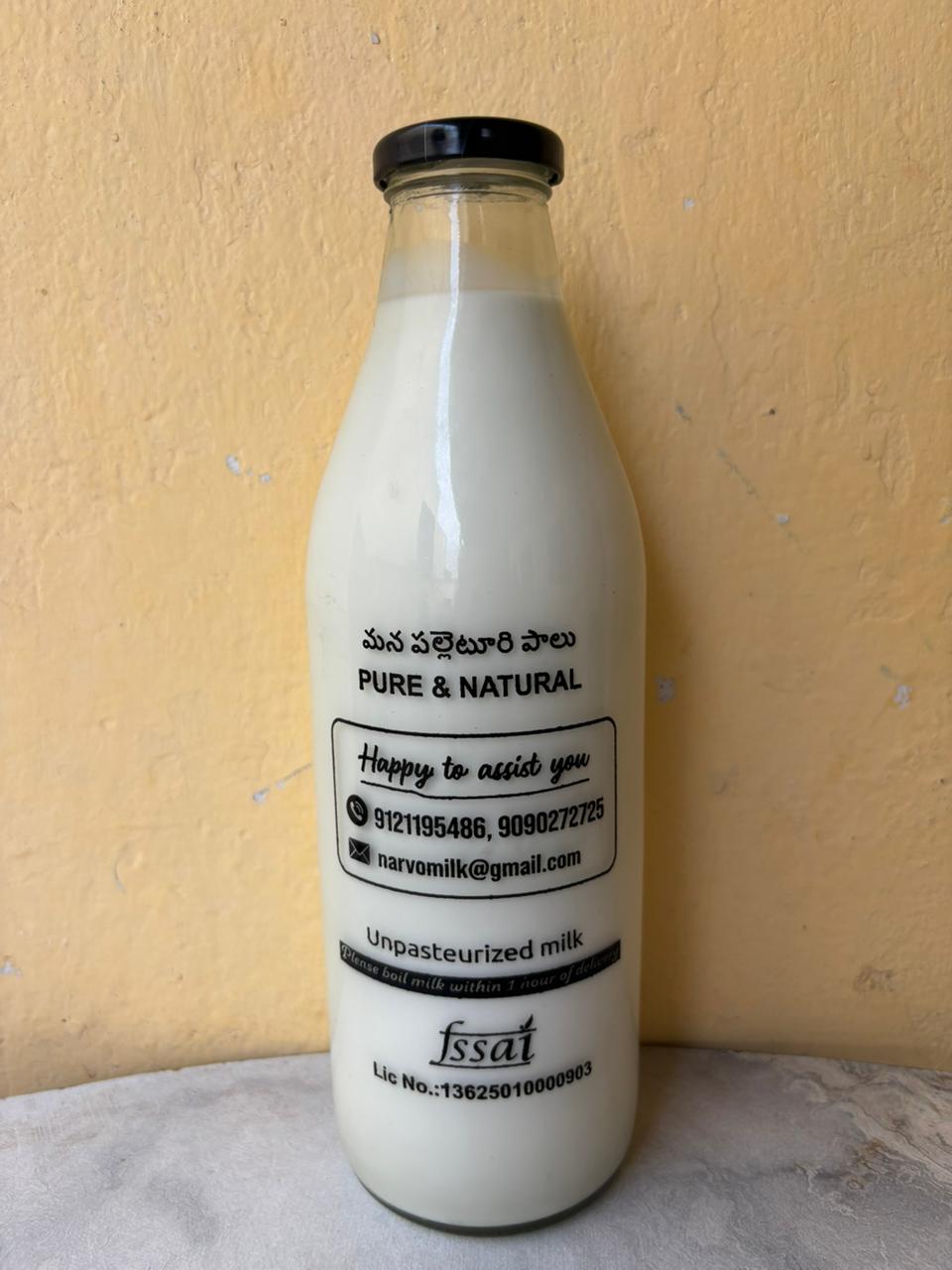 NarvoMilk 1 Litre bottle in natural sunlight on a farm wall